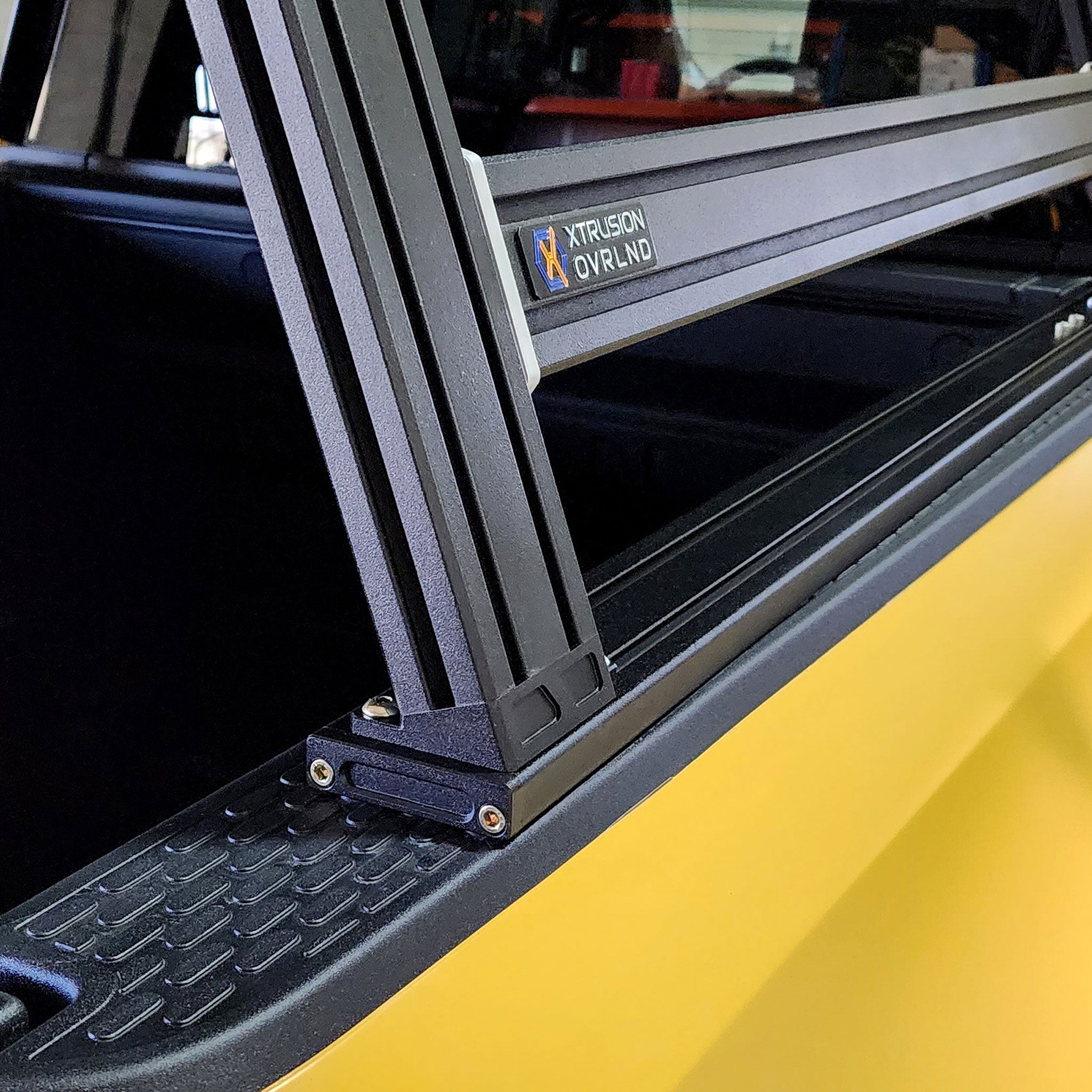 Rivian R1T XTR1 Bed Rack showing bed rail and bed bracket up close
