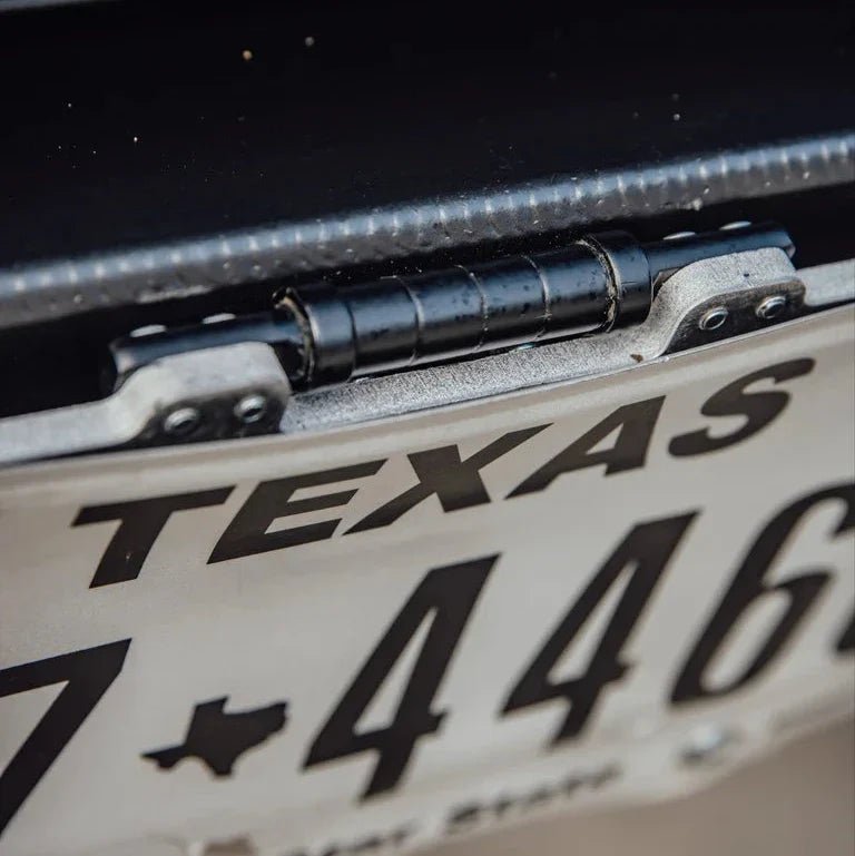 Flip up license plate bracket - Xtrusion Overland
