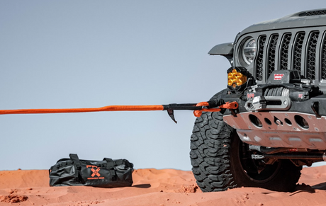 Safely secured recovery winch strap on an overland truck