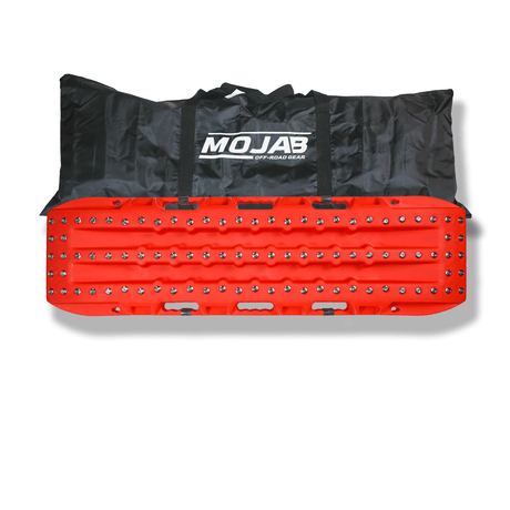 Colorful recovery traction board with travel duffel for overlanding