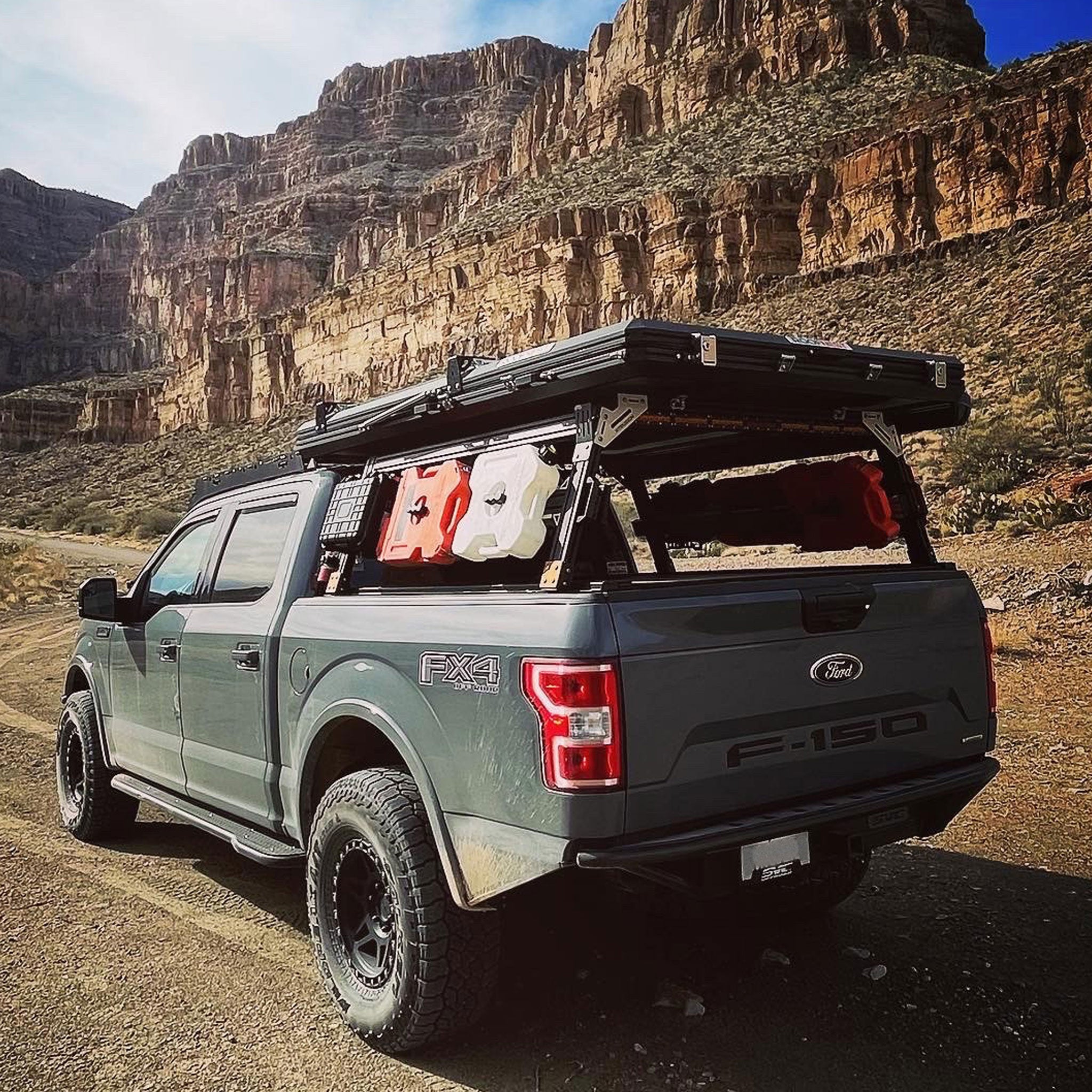 Ford F150 FX4 with Overland bed rack, roof top tent, and RotoPax