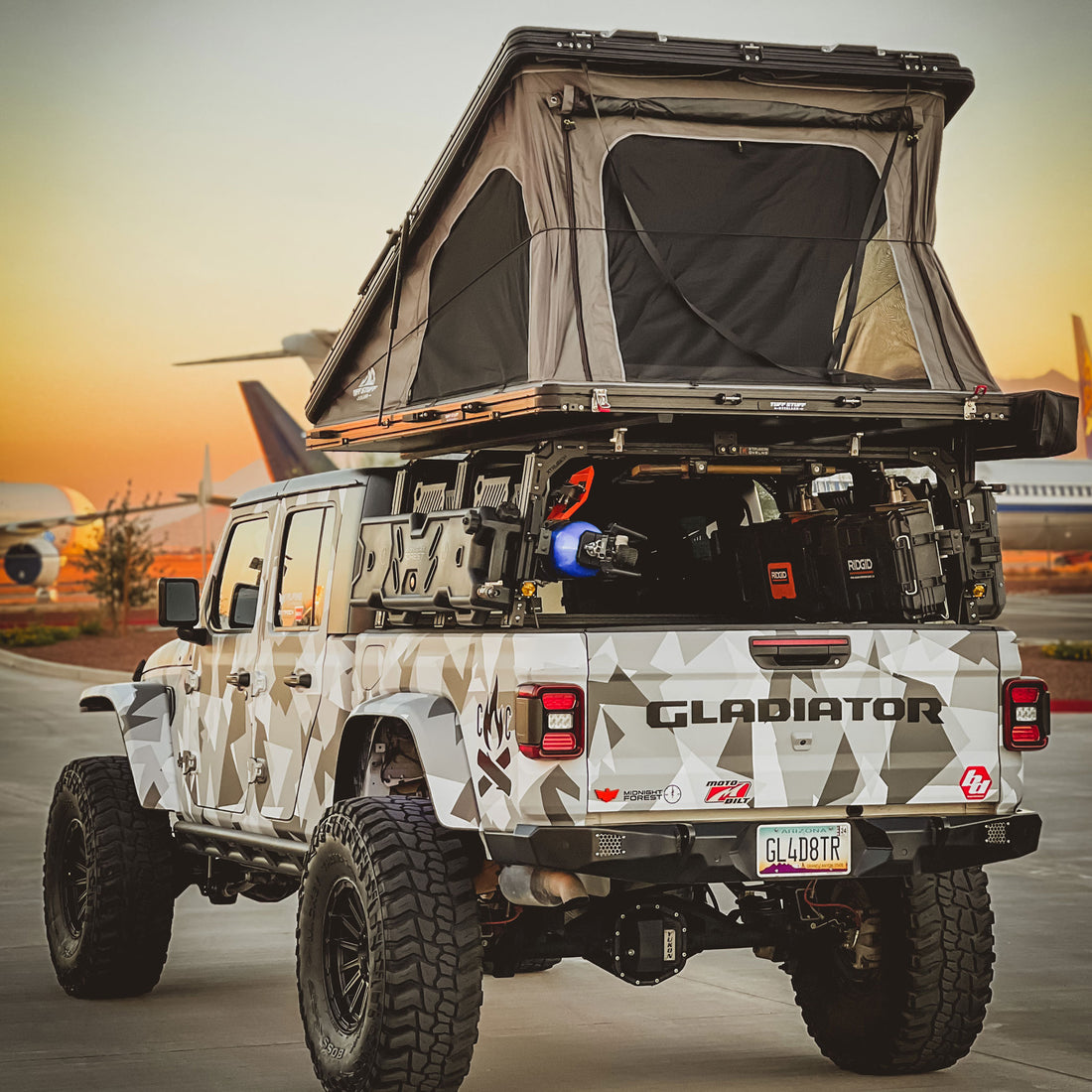 Jeep Gladiator with 9 Degree XTR3 - 22 inch high bed rack, open roof top tent,  storage cases, shovel, Power Tank, and off-road gear.