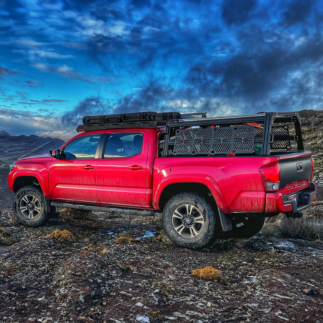 Red Toyota Tacoma with XTR1 Bed Rack with Molle Panels and Internal bed rack Slide Outs for accessories