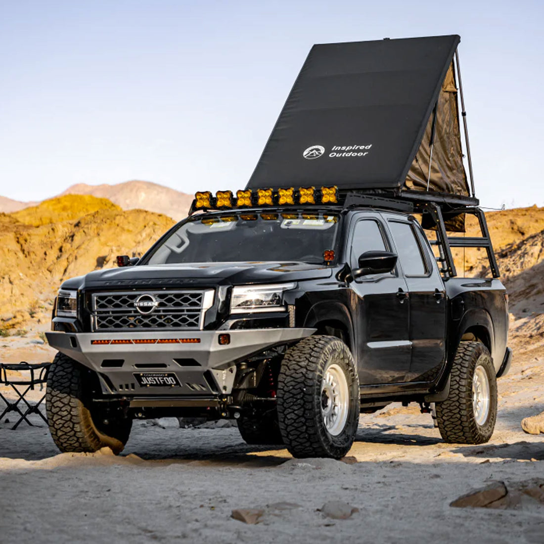 Nissan Frontier with XTR1 Overland bed rack and open go fast style roof top tent