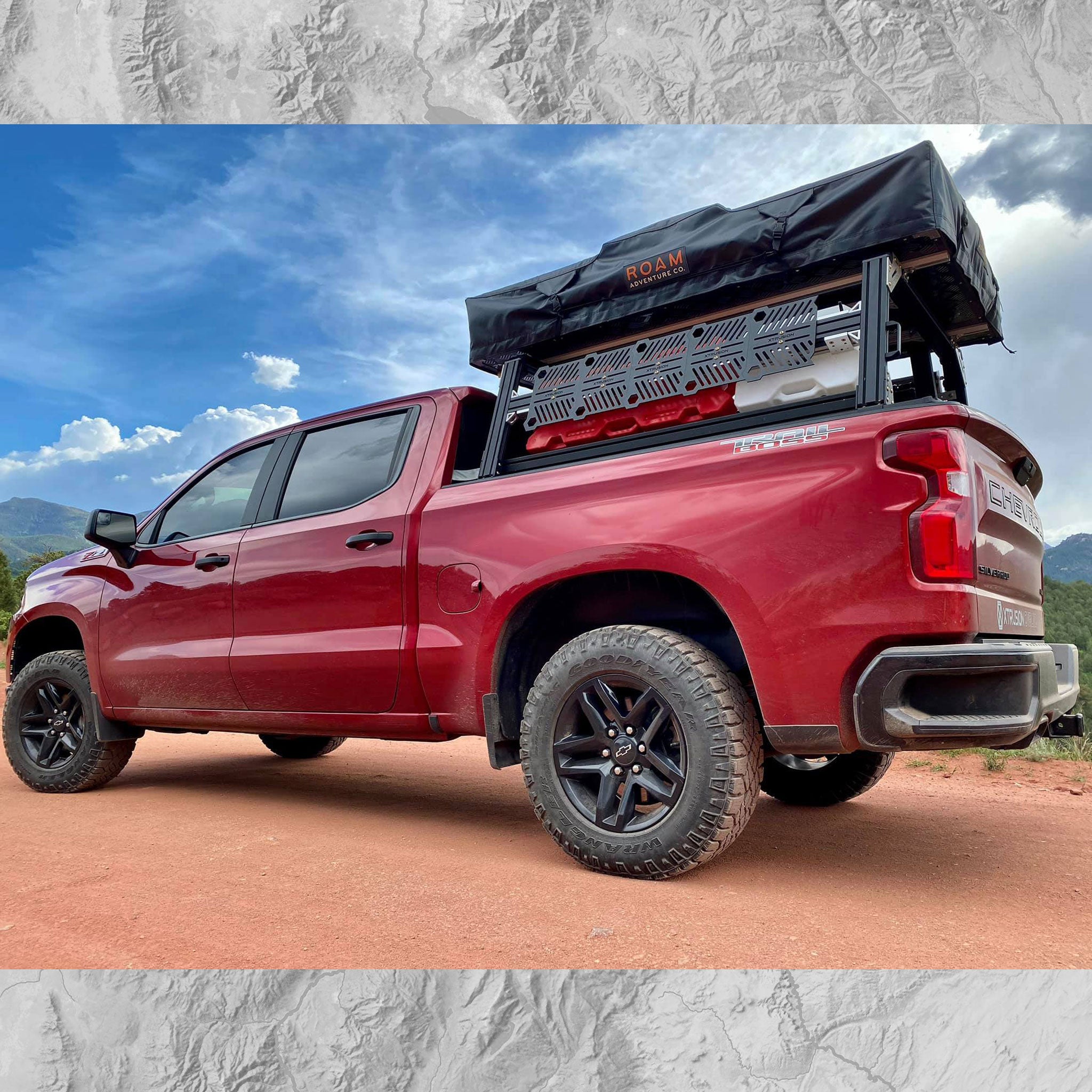 Chevy Trail Boss with Overlanding Bed Rack with Molle panels and roof top tent 