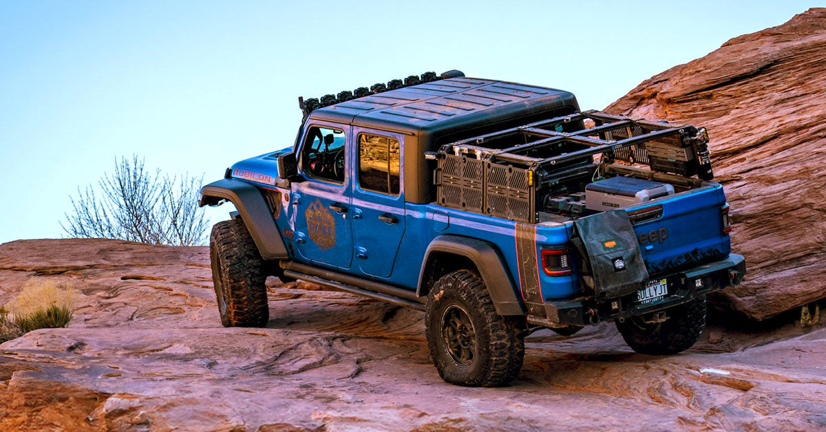 Jeep Gladiator with XTR3 Bed Rack driving up rock cliff - Ozark Overland Adventures
