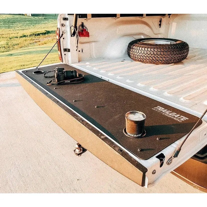Ram Truck (2010-2020) 1500/2500/3500 Tailgate TrailGate Insert with cup holders and a drink in one of the cup holders.