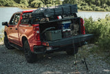 Silverado 1500 with a rooftop tent on XBRS bed bars, tailgate open with camping gear