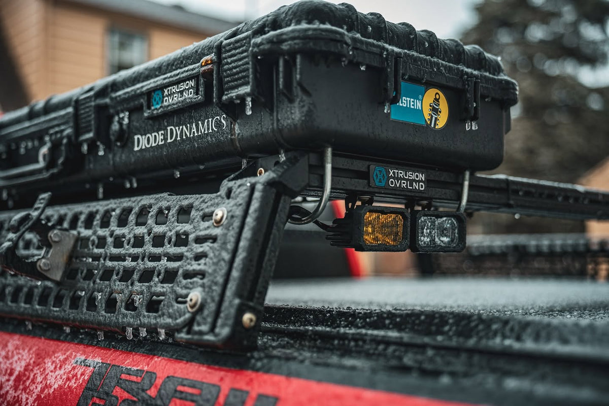 Hard case and pod lights mounted on XBRS cross bars on a Chevy Silverado