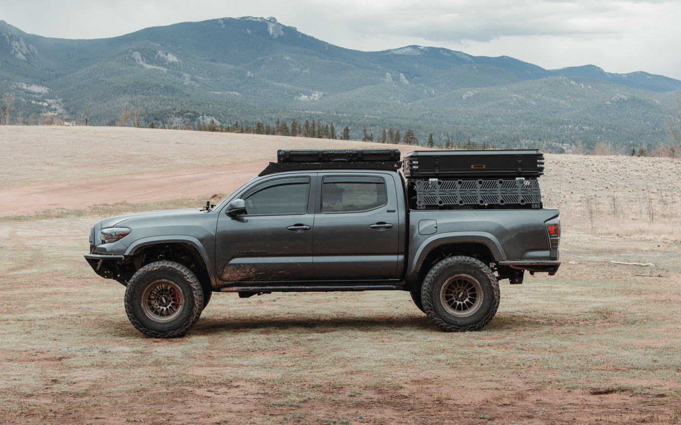 XTR1 modular bed rack on a Toyota Tacoma, side profile in the Colorado mountains