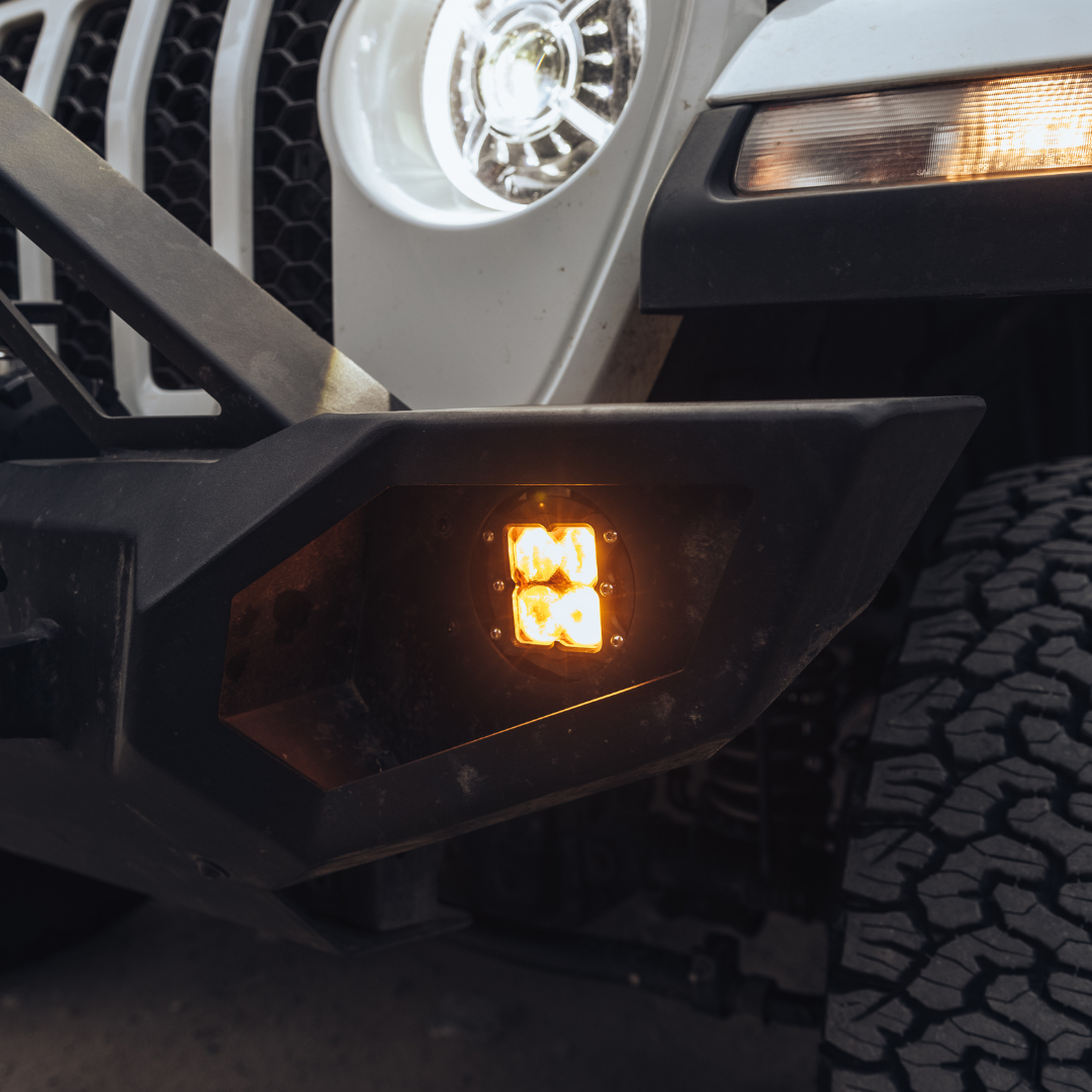 heretic quattro led fog light kit for jeep rubicon in amber mounted on a jeep 