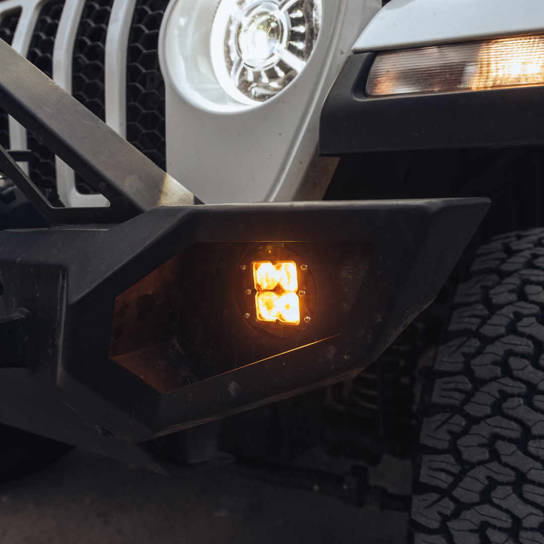 heretic quattro led fog light kit for jeep rubicon in mounted on a jeep