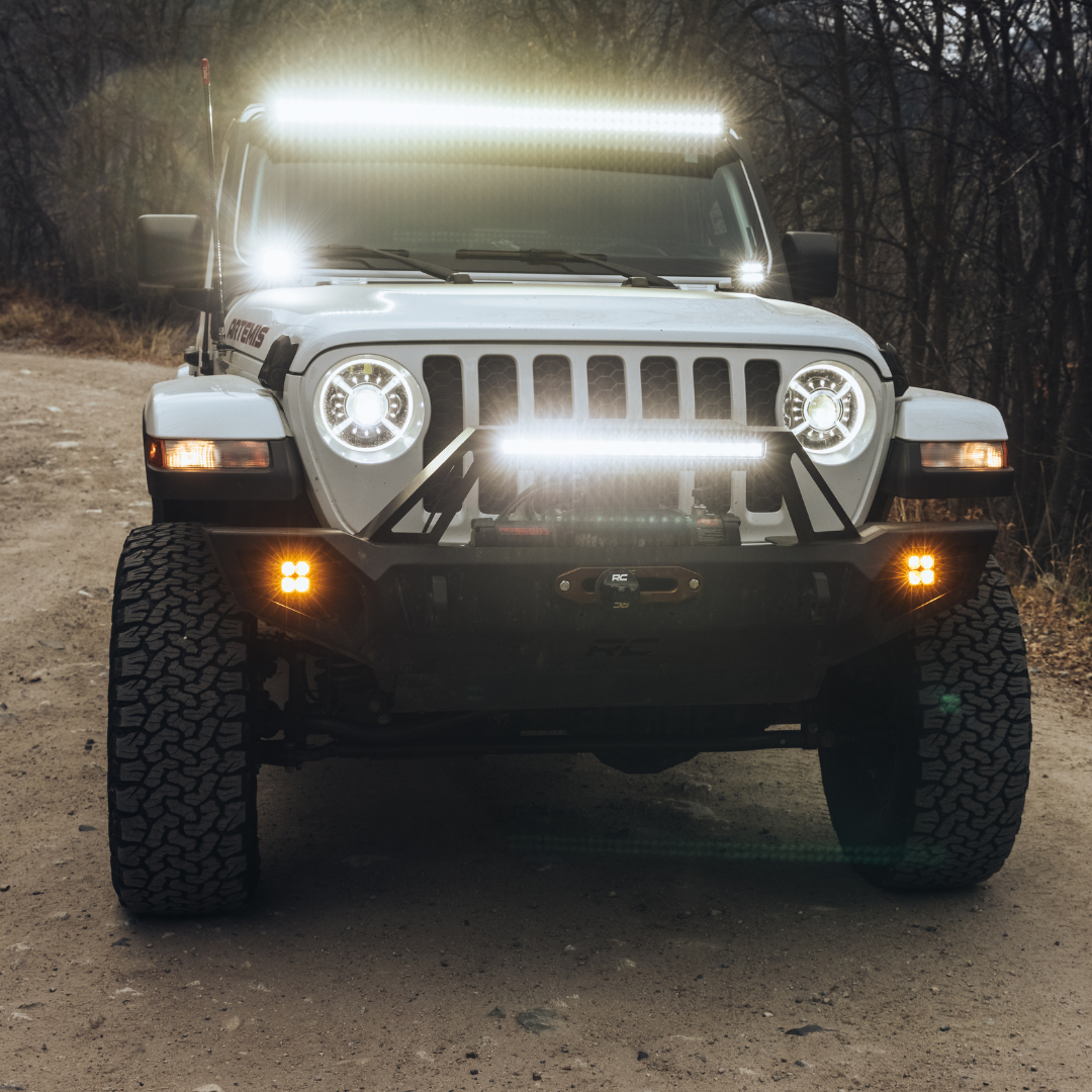 heretic quattro led fog light kit for jeep rubicon in mounted on a jeep