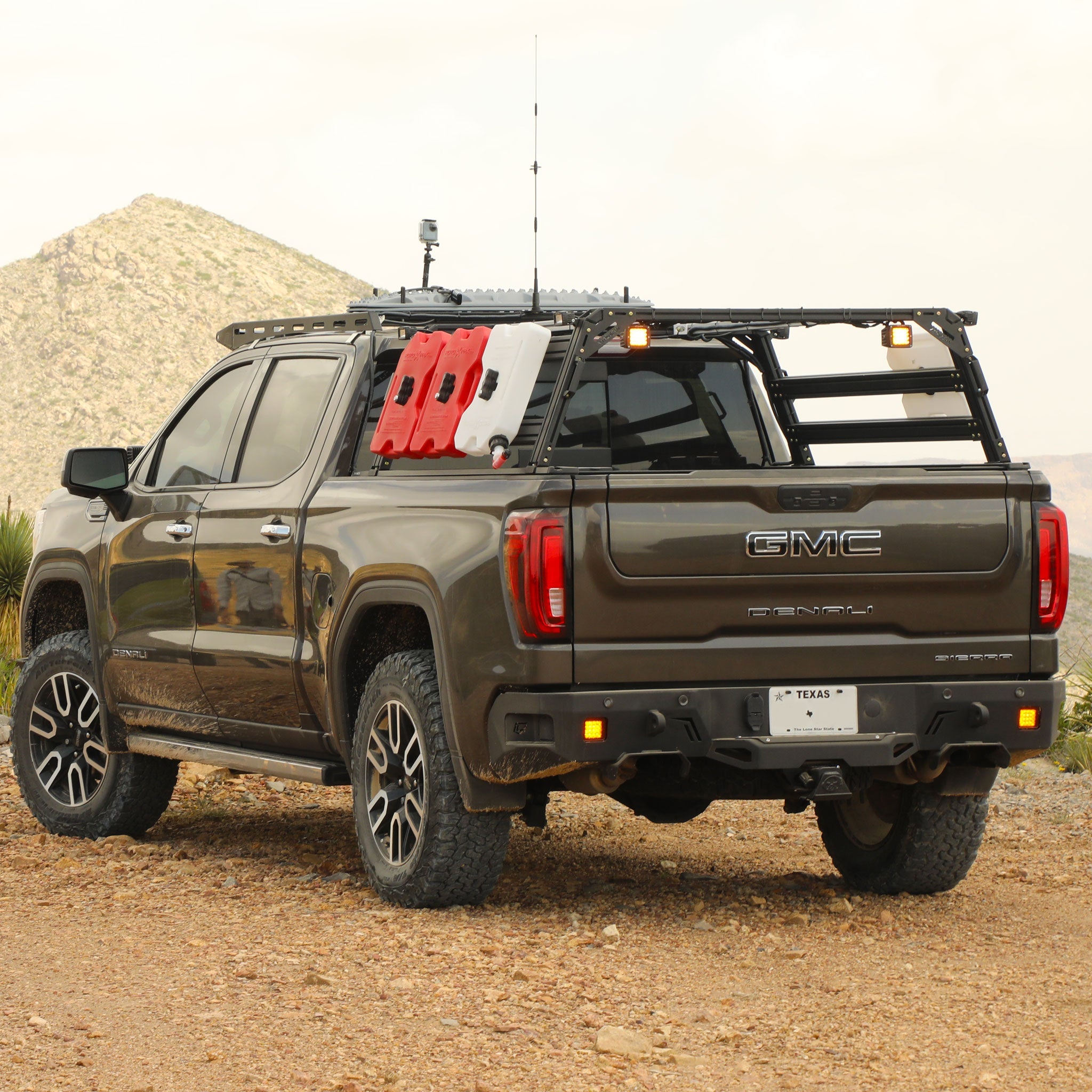 GMC Denali Sierra Xtrusion Overland Bed Rack with RotoPax, and Off-road lights.