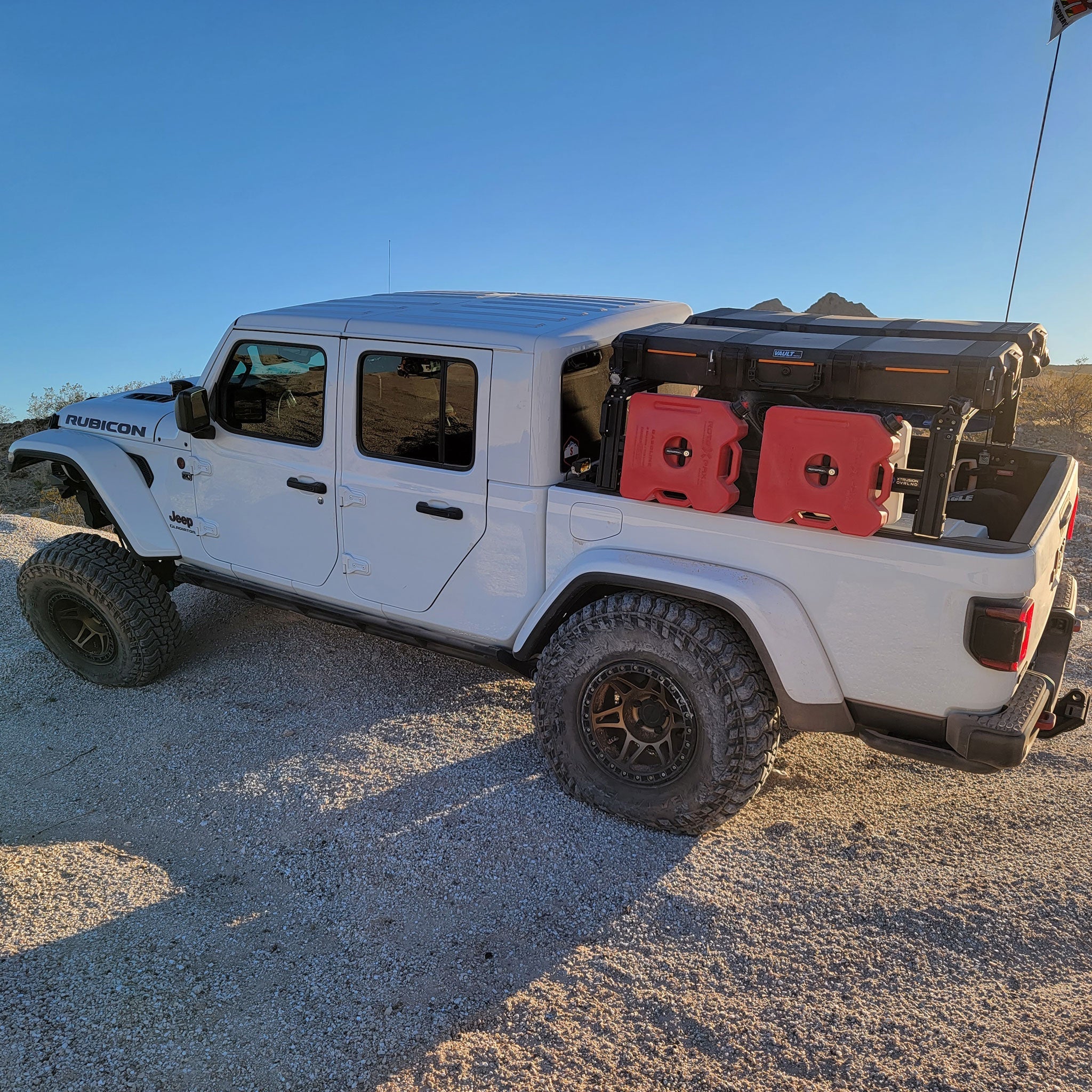 Jeep Gladiator Rubicon with XTR1 Bed Rack, RotoPax, Vault cases, and traction boards. 