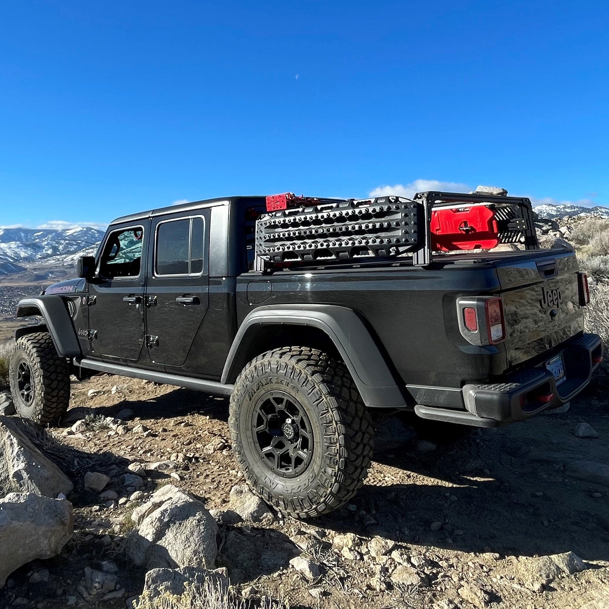 Xtrusion Overland XTR1 Bed rack for Jeep Gladiator with Molle Panels, RotoPax, Hi-Lift, and Traction boards.