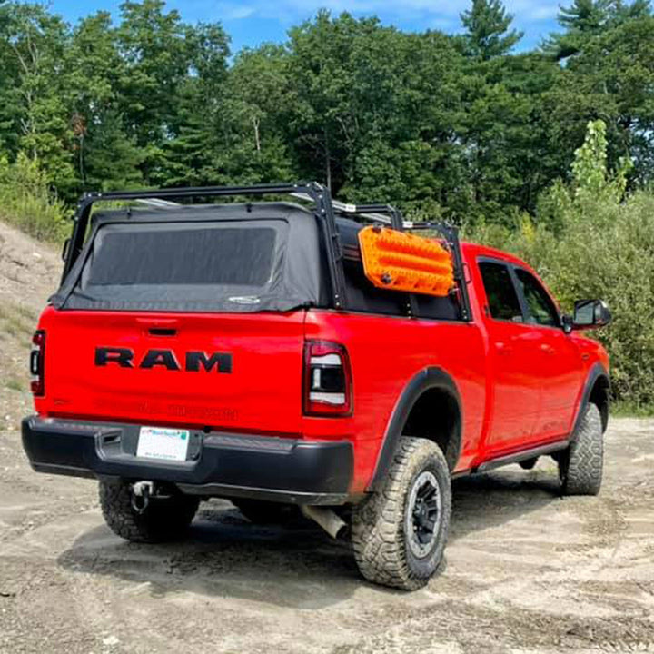 Dodge RAM 2500 and XTR1 HD (Heavy Duty) bed rack for SofTopper equipped with HD triple column uprights, 15-inch Xtrusion Molle panels, and traction boards mounted to molle’s.