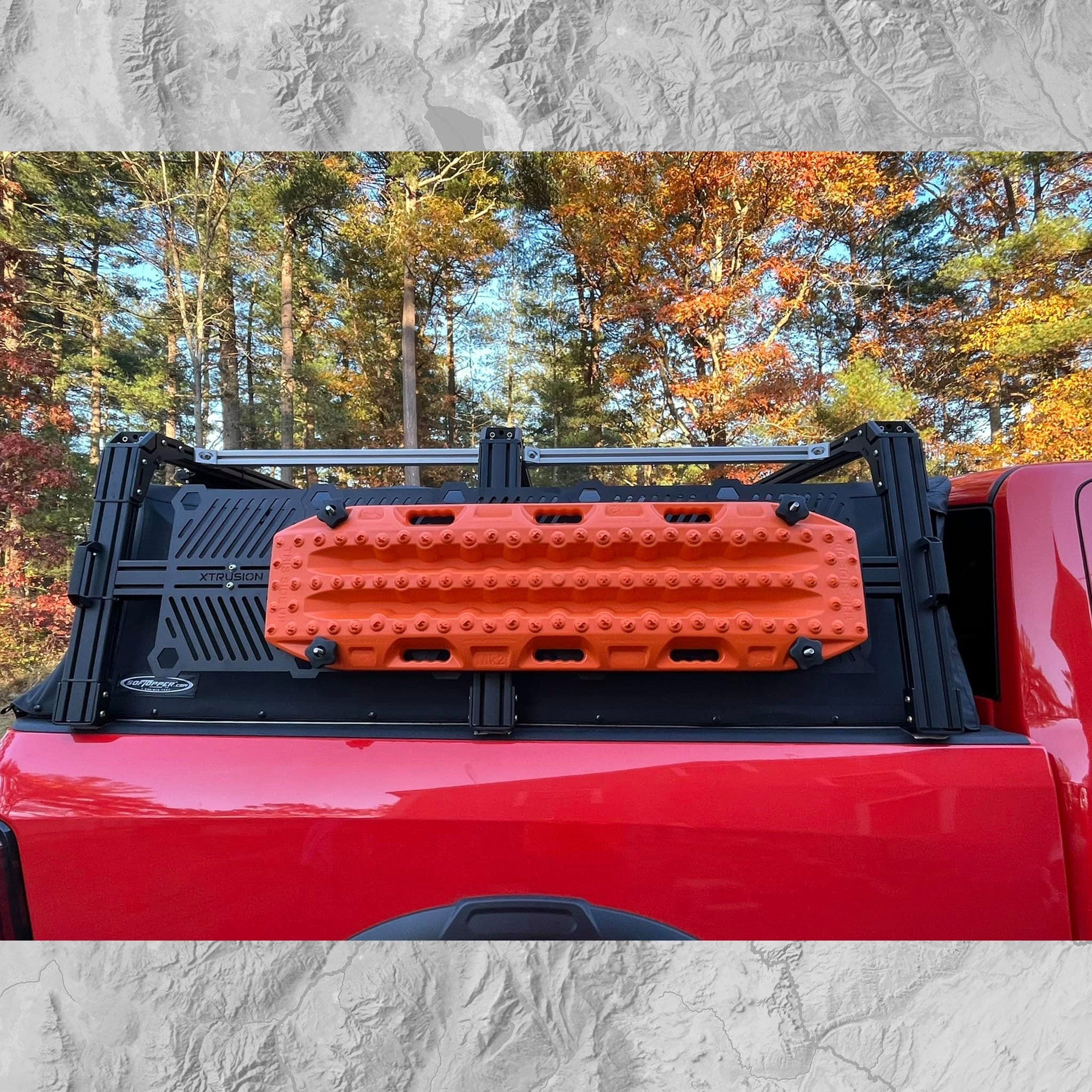 RAM 2500 Mounted XTR1 HD (Heavy Duty) with triple column uprights and 15 inch Xtrusion Molle panels. and Traction boards mounted to Bed Rack.