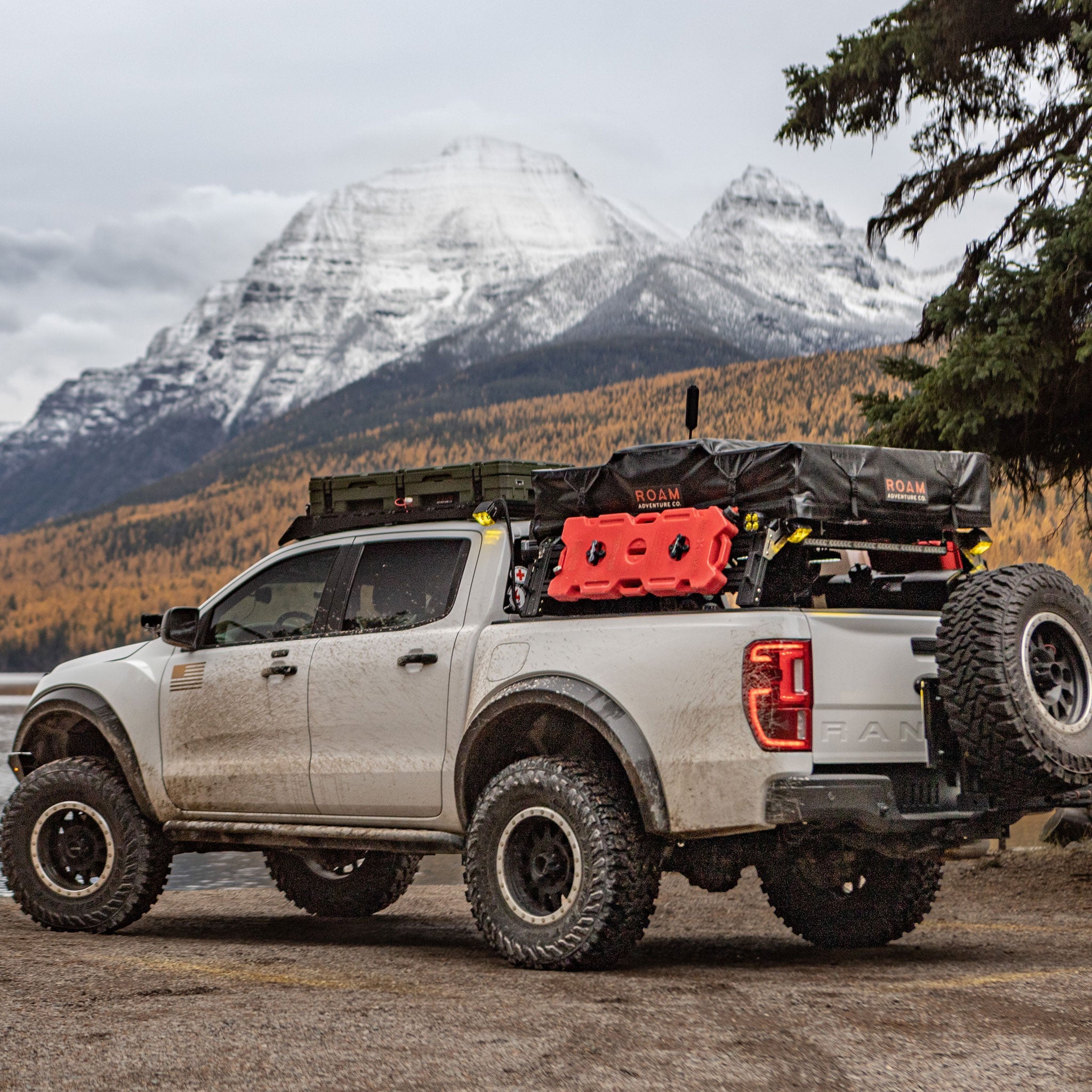 Ford Ranger with xtrusion bed rack Roof top tent, off-road lights, Rotopax, and overlanding gear.