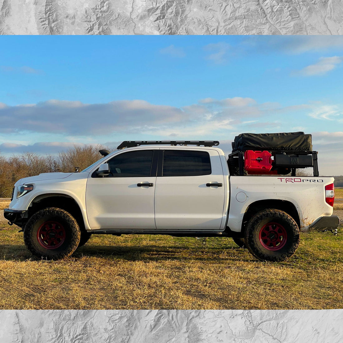 Toyota Tundra with Xtrusion Overland XTR1 Bed Rack with mounted roof top tent, water tank, and RotoPax.